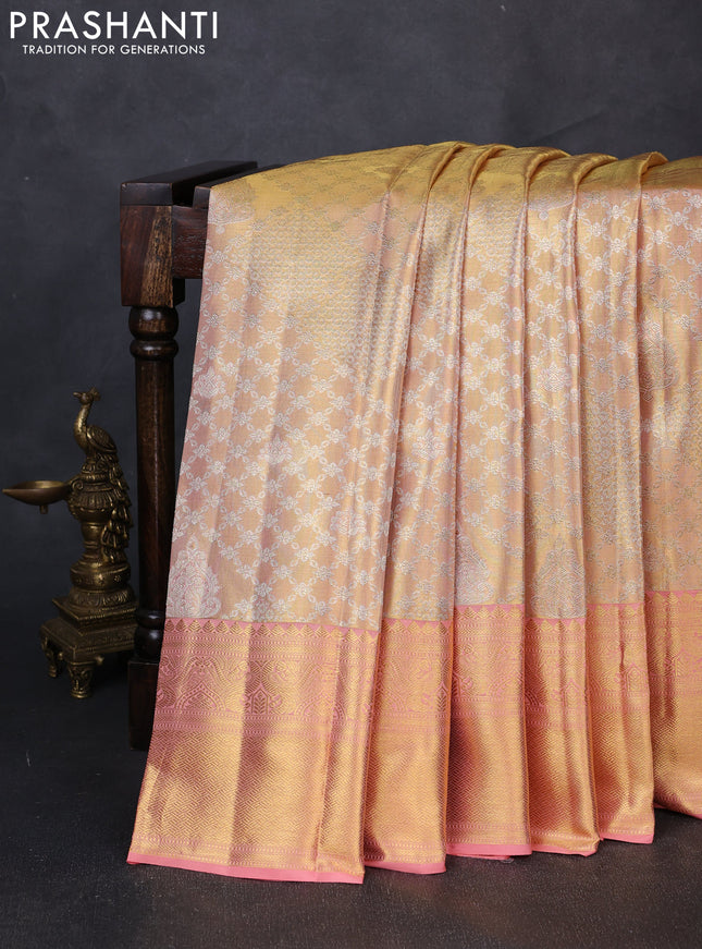 Pure kanchipuram tissue silk saree mild peach and peach with allover silver zari woven brocade weaves and rich zari woven border