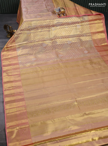 Pure kanchipuram tissue silk saree mild peach and peach with allover silver zari woven brocade weaves and rich zari woven border