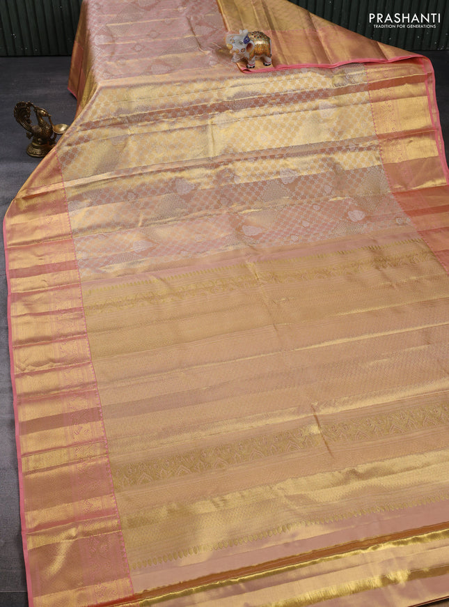 Pure kanchipuram tissue silk saree mild peach and peach with allover silver zari woven brocade weaves and rich zari woven border