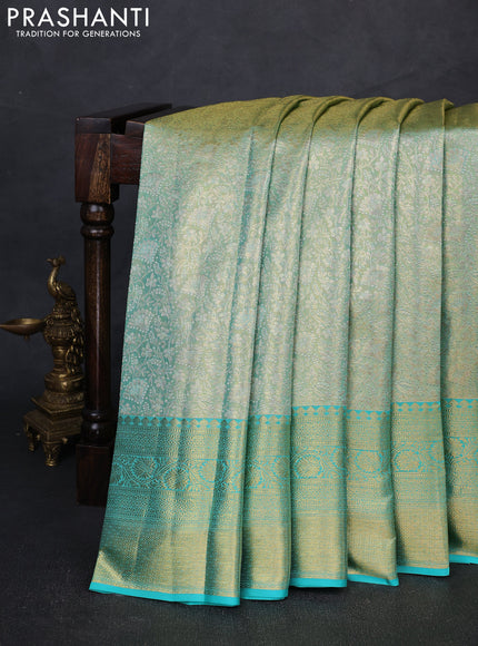 Pure kanchipuram tissue silk saree dual shade of teal and teal blue with allover zari woven brocade weaves and rich zari woven border