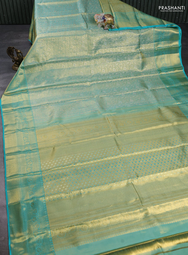 Pure kanchipuram tissue silk saree dual shade of teal and teal blue with allover zari woven brocade weaves and rich zari woven border