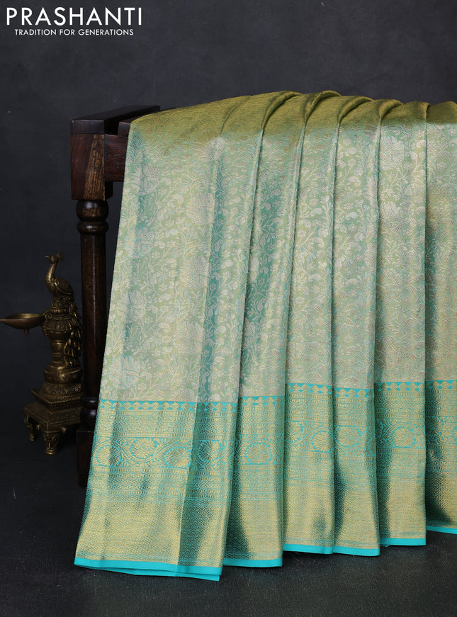 Pure kanchipuram tissue silk saree dual shade of teal and teal blue with allover zari woven brocade weaves and rich zari woven border