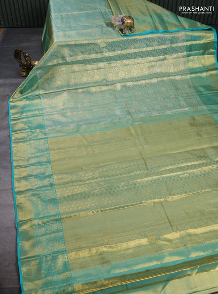 Pure kanchipuram tissue silk saree dual shade of teal and teal blue with allover zari woven brocade weaves and rich zari woven border