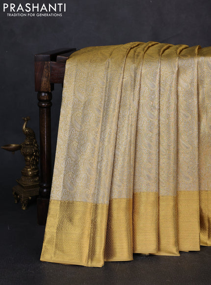Pure kanchipuram tissue silk saree gold with allover zari woven paisley brocade weaves and rich zari woven border