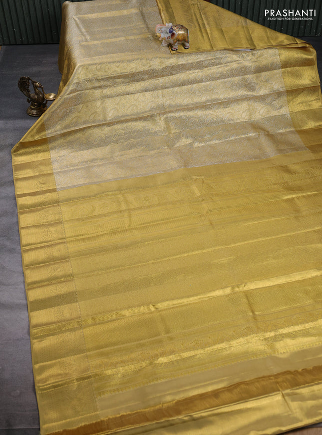 Pure kanchipuram tissue silk saree gold with allover zari woven paisley brocade weaves and rich zari woven border