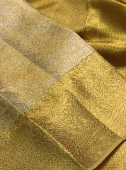 Pure kanchipuram tissue silk saree gold with allover zari woven paisley brocade weaves and rich zari woven border