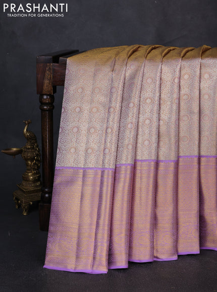 Pure kanchipuram tissue silk saree dual shade of mild lavender and lavender with allover zari woven brocade weaves and long rich zari woven border