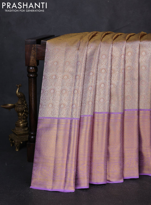 Pure kanchipuram tissue silk saree dual shade of mild lavender and lavender with allover zari woven brocade weaves and long rich zari woven border