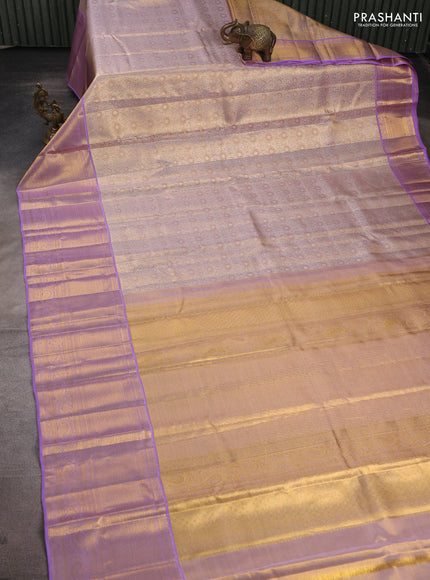 Pure kanchipuram tissue silk saree dual shade of mild lavender and lavender with allover zari woven brocade weaves and long rich zari woven border