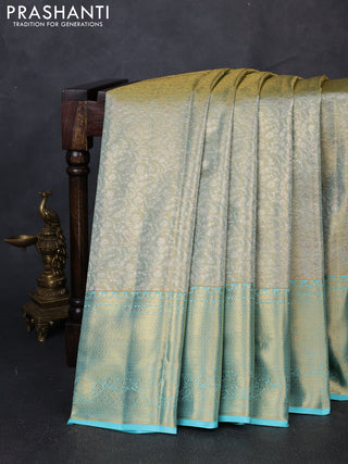 Pure kanchipuram tissue silk saree dual shade of gold and teal blue with allover zari woven brocade weaves and long rich zari woven border