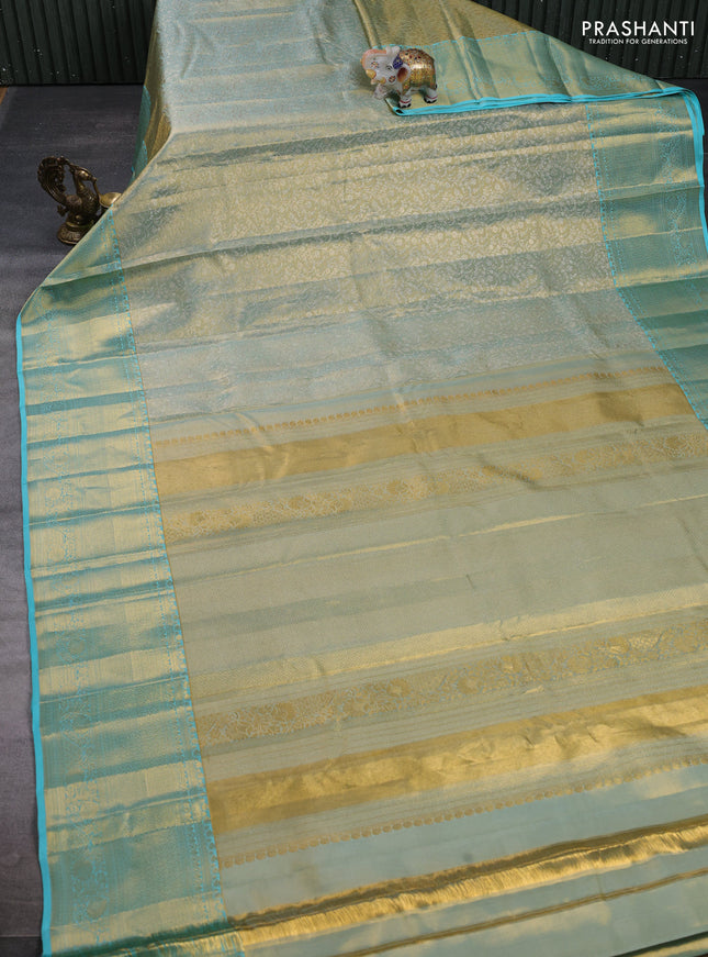Pure kanchipuram tissue silk saree dual shade of gold and teal blue with allover zari woven brocade weaves and long rich zari woven border