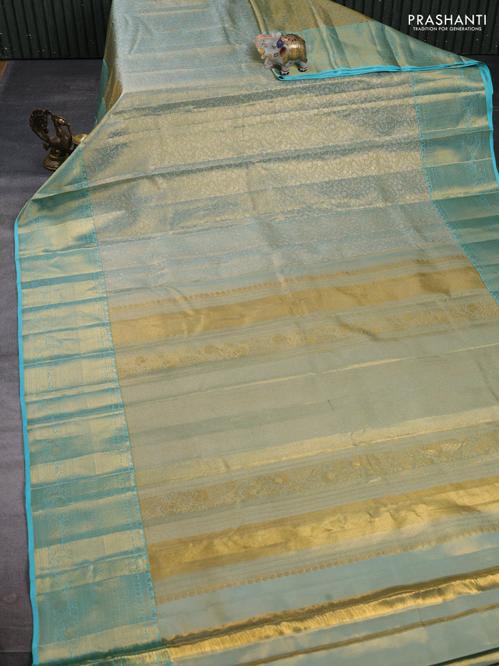 Pure kanchipuram tissue silk saree dual shade of gold and teal blue with allover zari woven brocade weaves and long rich zari woven border