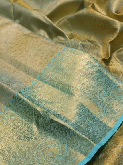 Pure kanchipuram tissue silk saree dual shade of gold and teal blue with allover zari woven brocade weaves and long rich zari woven border