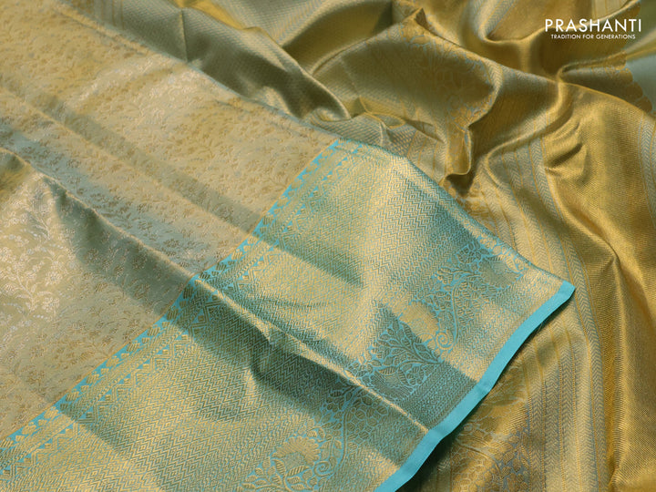 Pure kanchipuram tissue silk saree dual shade of gold and teal blue with allover zari woven brocade weaves and long rich zari woven border