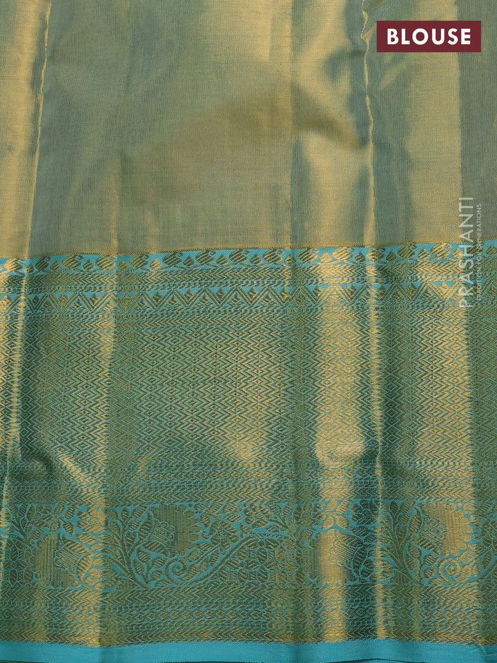 Pure kanchipuram tissue silk saree dual shade of gold and teal blue with allover zari woven brocade weaves and long rich zari woven border