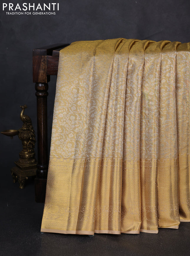 Pure kanchipuram tissue silk saree gold with allover zari woven brocade weaves and long rich zari woven border