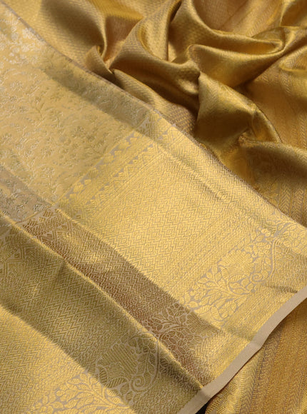 Pure kanchipuram tissue silk saree gold with allover zari woven brocade weaves and long rich zari woven border