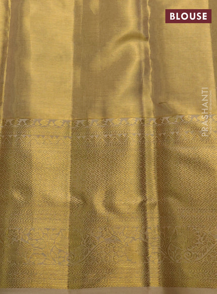 Pure kanchipuram tissue silk saree gold with allover zari woven brocade weaves and long rich zari woven border