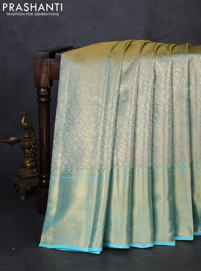 Pure kanchipuram tissue silk saree dual shade of teal and teal blue with allover zari woven brocade weaves and long rich zari woven border