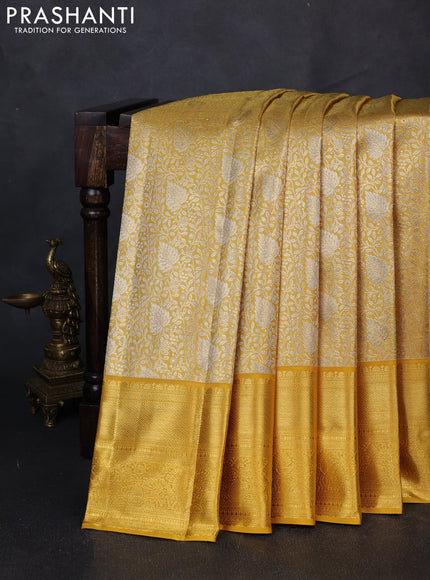 Pure kanchipuram tissue silk saree golden yellow with allover zari woven brocade weaves and rich zari woven border