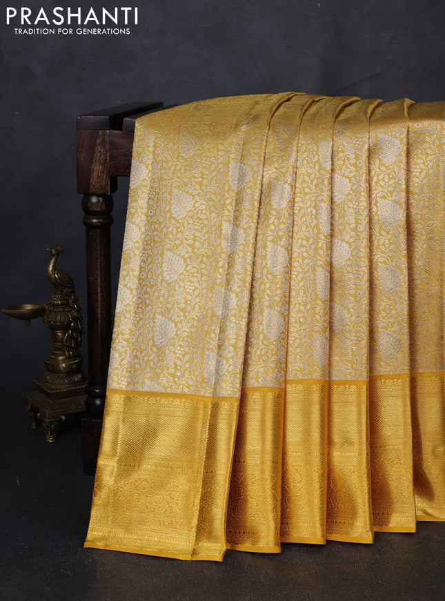 Pure kanchipuram tissue silk saree golden yellow with allover zari woven brocade weaves and rich zari woven border