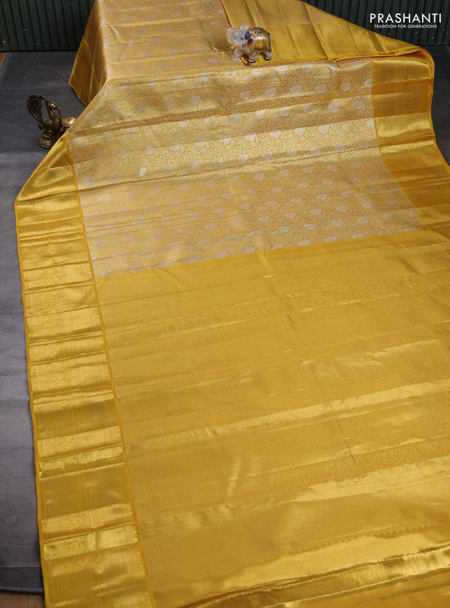 Pure kanchipuram tissue silk saree golden yellow with allover zari woven brocade weaves and rich zari woven border