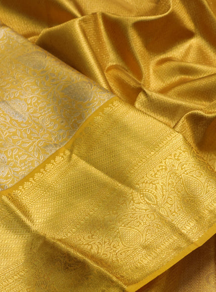 Pure kanchipuram tissue silk saree golden yellow with allover zari woven brocade weaves and rich zari woven border