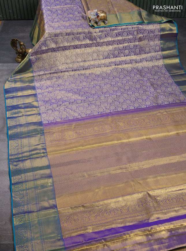 Pure kanchipuram tissue silk saree dual shade of lavender and dual shade of teal blue with allover zari woven brocade weaves and long rich zari woven border