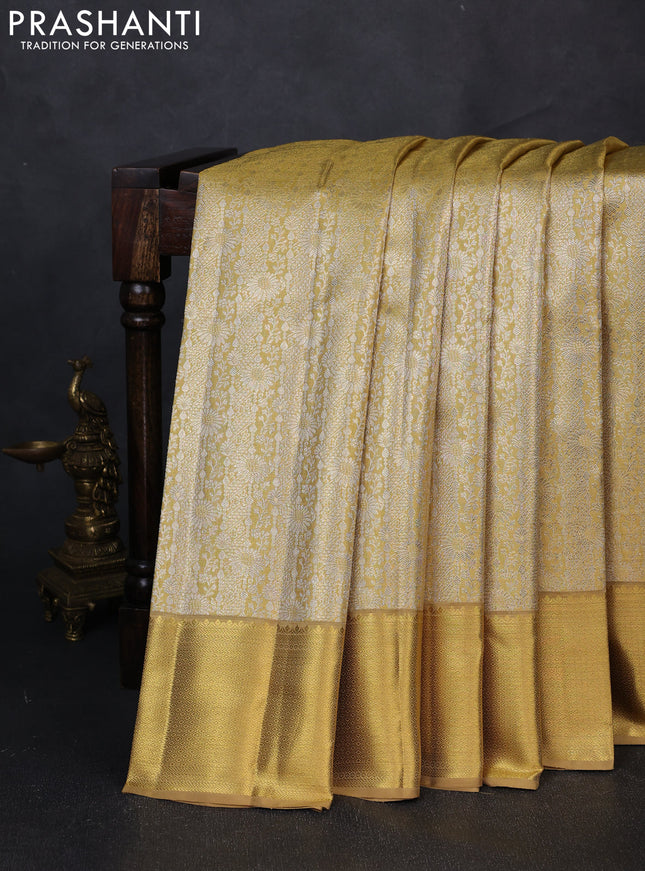 Pure kanchipuram tissue silk saree gold with allover zari woven brocade weaves and rich zari woven border