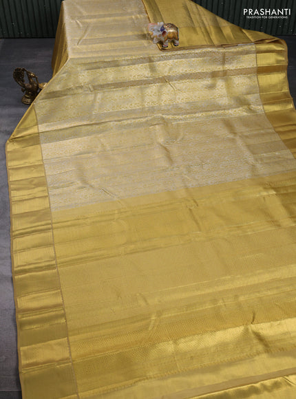 Pure kanchipuram tissue silk saree gold with allover zari woven brocade weaves and rich zari woven border