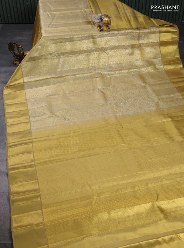 Pure kanchipuram tissue silk saree gold with allover zari woven brocade weaves and rich zari woven border