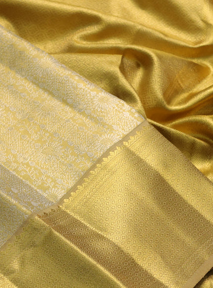 Pure kanchipuram tissue silk saree gold with allover zari woven brocade weaves and rich zari woven border
