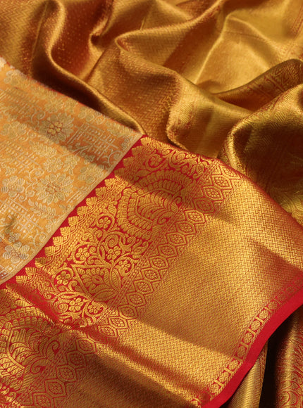 Pure kanchipuram tissue silk saree dual shade of golden red and red with allover zari woven brocade weaves and rich zari woven border