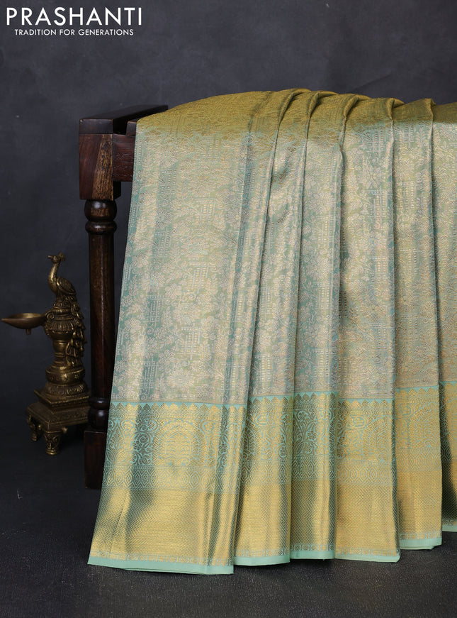 Pure kanchipuram tissue silk saree dual shade of teal with allover zari woven brocade weaves and rich zari woven border