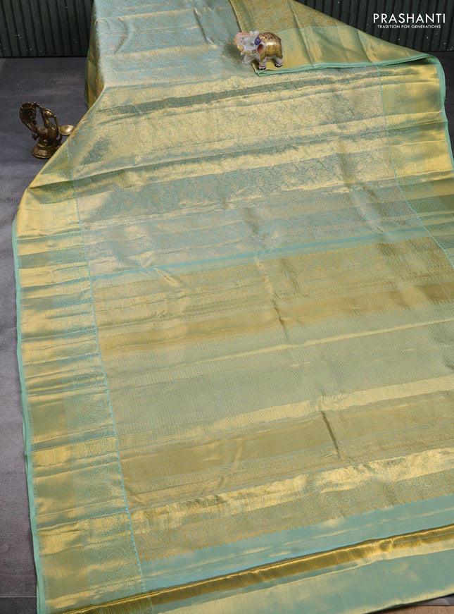 Pure kanchipuram tissue silk saree dual shade of teal with allover zari woven brocade weaves and rich zari woven border