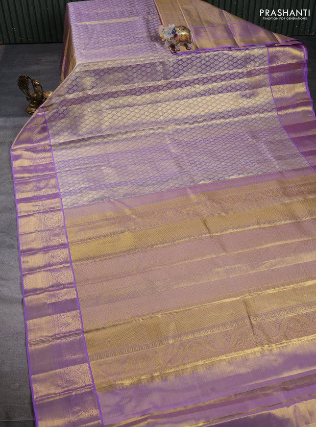 Pure kanchipuram tissue silk saree dual shade of lavender with allover zari woven brocade weaves and rich zari woven border