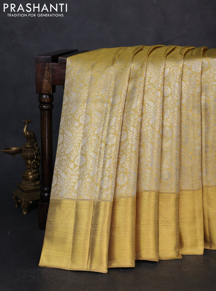 Pure kanchipuram tissue silk saree gold with allover zari woven brocade weaves and rich zari woven border