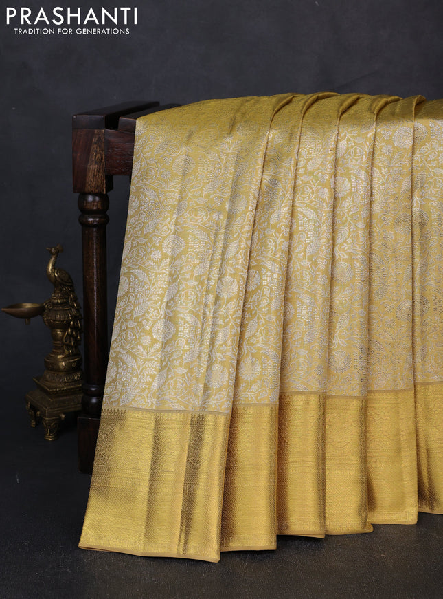 Pure kanchipuram tissue silk saree gold with allover zari woven brocade weaves and rich zari woven border