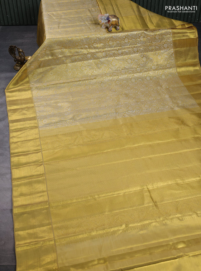 Pure kanchipuram tissue silk saree gold with allover zari woven brocade weaves and rich zari woven border