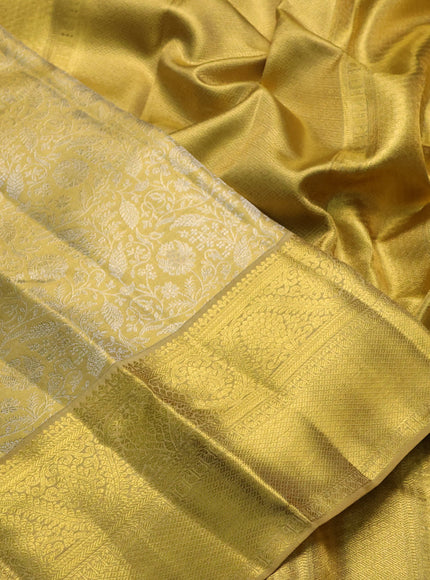 Pure kanchipuram tissue silk saree gold with allover zari woven brocade weaves and rich zari woven border