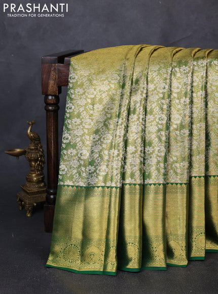 Pure kanchipuram tissue silk saree light green and green with allover zari woven brocade weaves and long rich zari woven border