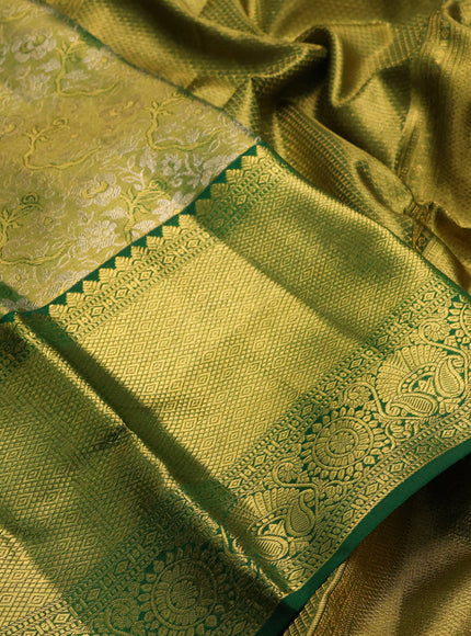 Pure kanchipuram tissue silk saree light green and green with allover zari woven brocade weaves and long rich zari woven border