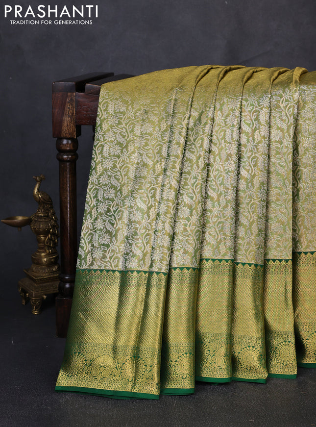 Pure kanchipuram tissue silk saree light green and green with allover zari woven brocade weaves and long rich zari woven border