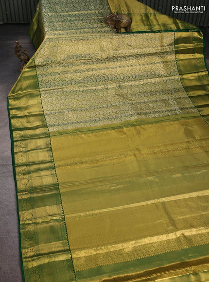Pure kanchipuram tissue silk saree light green and green with allover zari woven brocade weaves and long rich zari woven border