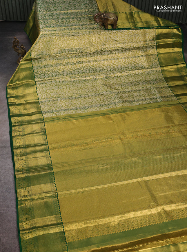 Pure kanchipuram tissue silk saree light green and green with allover zari woven brocade weaves and long rich zari woven border