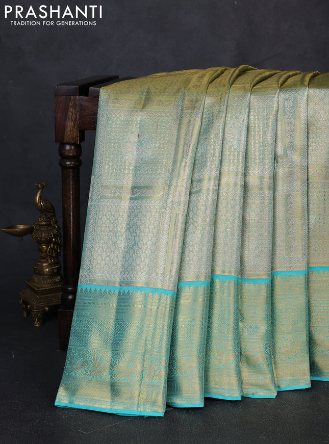 Pure kanchipuram tissue silk saree golden teal and teal blue with allover silver zari woven brocade weaves and rich zari woven border