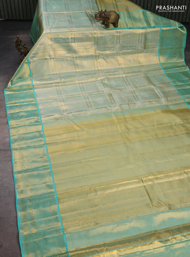 Pure kanchipuram tissue silk saree golden teal and teal blue with allover silver zari woven brocade weaves and rich zari woven border