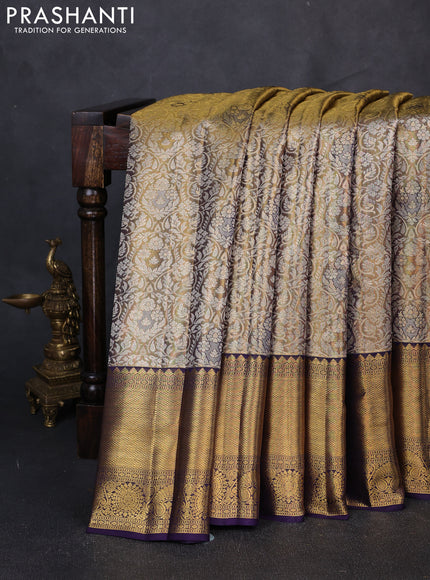 Pure kanchipuram tissue silk saree gold and navy blue with allover zari woven brocade weaves and long rich zari woven border