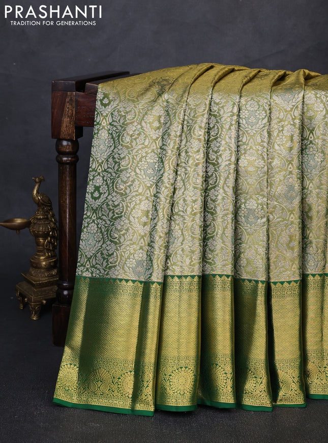 Pure kanchipuram tissue silk saree light green and green with allover zari woven brocade weaves and long rich zari woven border
