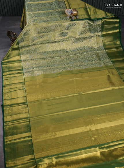 Pure kanchipuram tissue silk saree light green and green with allover zari woven brocade weaves and long rich zari woven border